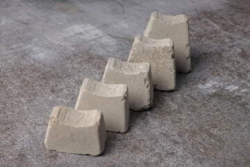 Concrete spacers for rebar, various sizes