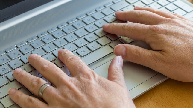 Computer with hand on the keyboard, Homeoffice is popular during the pandemic time