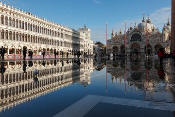 Procuratie Vecchie, Basilica di San Marco and Clocktower are Reflected in the High Water (Acqua alta) of St. Mark's Square; Venice