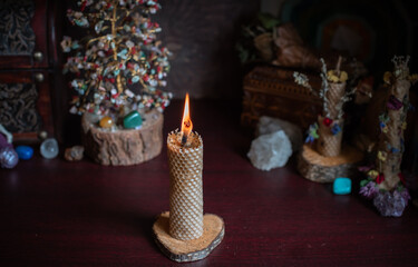 Magical attribute on a table, witchcraft concept, Candle fire, Spells and other rituals