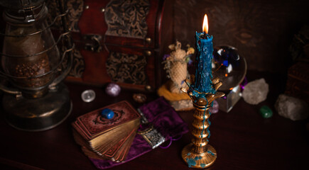 Magical attribute on a table, witchcraft concept, Candle fire, Spells and other rituals