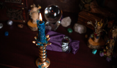 Magical attribute on a table, witchcraft concept, Candle fire, Spells and other rituals