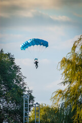 Paratrooper flying over the city park in Belgrade Serbia, during the Boat Carnival