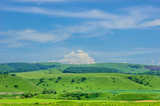 Landscape With Green Hills And Blue Sky