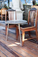 Vintage wooden chair and table set at a modern coffee shop