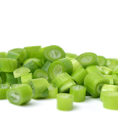 chopped green onions on white background