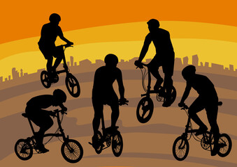 silhouette image of people playing folding bike