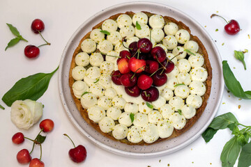 Cherry pie with pistachio cream, basil, and whipped cream.