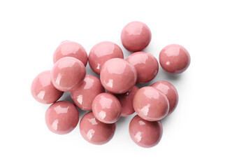 Delicious pink chocolate candies on white background, top view