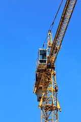 Fototapeta na wymiar construction crane against blue sky