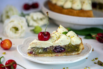 Cherry pie with pistachio cream, basil, and whipped cream.