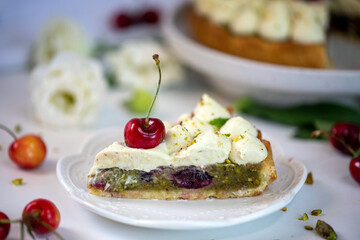 Cherry pie with pistachio cream, basil, and whipped cream.