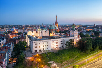 Naklejka na ściany i meble Szczecin, Poland. Aerial view of historic Pomeranian Dukes Castle at dusk