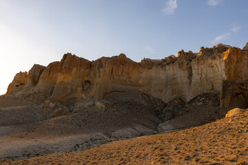 Obraz premium The north-east side of Sherkala mountain just after sunrise. Mangystau Province, western Kazakhstan, close to the town of Shetpe.