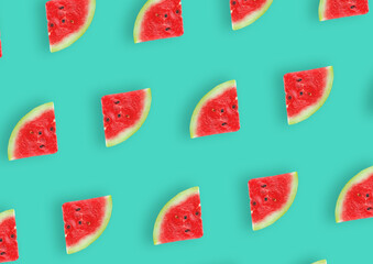 Fresh watermelon slice pattern on a green background repeating. Summer fruit. Top view. 