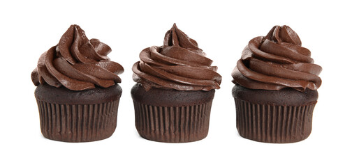 Delicious chocolate cupcakes with cream on white background