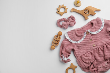 Flat lay composition with baby clothes and accessories on white background, space for text