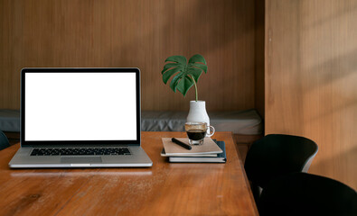 Mockup blank screen laptop computer on wooden table in wooden office room. - Powered by Adobe