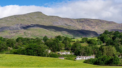 Fototapeta na wymiar Early morning light on the village of Coniston & the 'Old Man' towering over the village