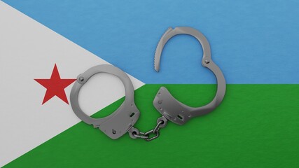 A half opened steel handcuff in center on top of the national flag of Djibouti