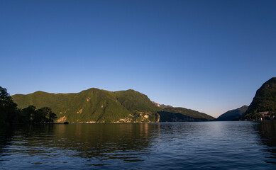 idillc view of Lake Lugano in Ticino Switzerland on a beautiful day without any clouds in the sky