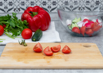 Slices of tomatoes lying on the cutting board