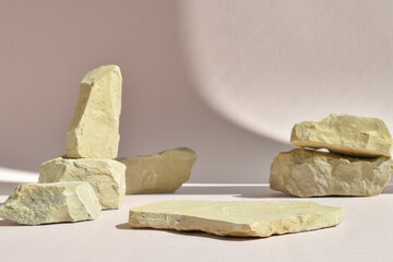 Minimalistic scene of a lying stone on a background of stones. Catwalk for the presentation of...