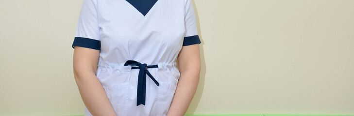 doctor or nurse in a white medical coat 