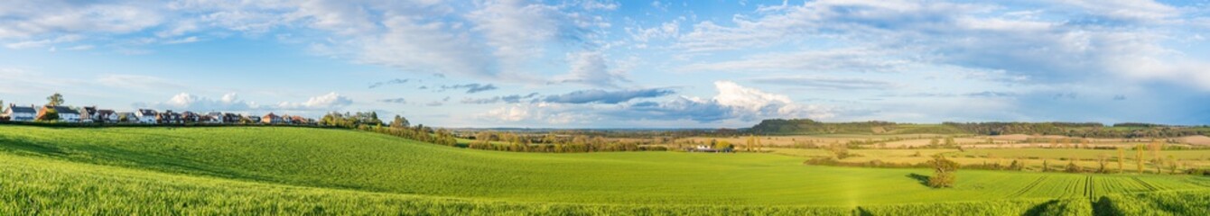 Fototapeta na wymiar Green field panorama in spring season. Landscape of England near Harlington village