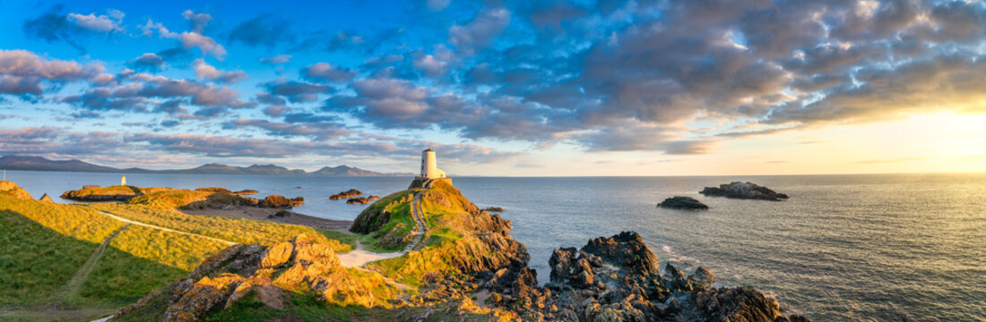 Sceninc sunset view of Lighthouse on Llanddwyn Island at the coast of Anglesey in North Wales,UK
