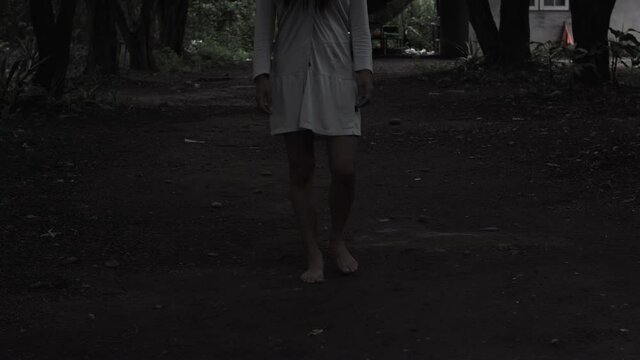 The ghost zombie of a woman walking to camera. horror scene of scary fear on hell is monster devil girl in halloween festival concept.