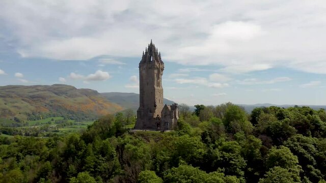 4k drone footage of the National Wallace Monument overlooking the city of Stirling in Scotland, UK