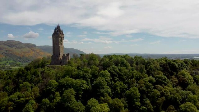 4k drone footage of the National Wallace Monument overlooking the city of Stirling in Scotland, UK