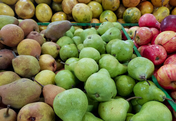Ripe and green pears in the supermarket