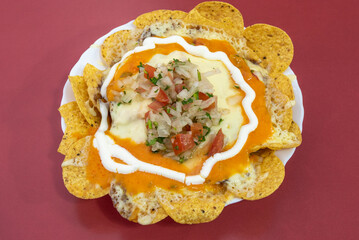 Nachos with gratin cheeses served in Latin restaurant