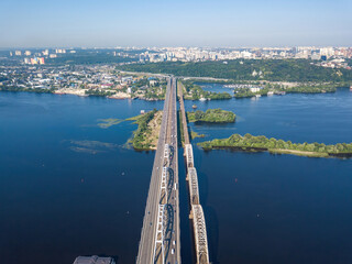 Darnitsky bridge in Kiev in sunny weather. Aerial drone view.