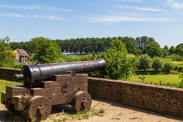 Old cannon on the ramparts on the edge of the old picturesque fortified town of Buren in the province of Gelderland.