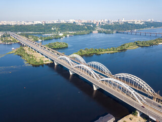 Darnitsky bridge in Kiev in sunny weather. Aerial drone view.