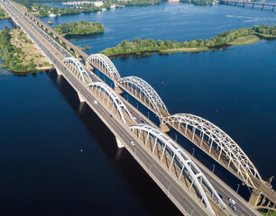 Darnitsky bridge in Kiev in sunny weather. Aerial drone view.