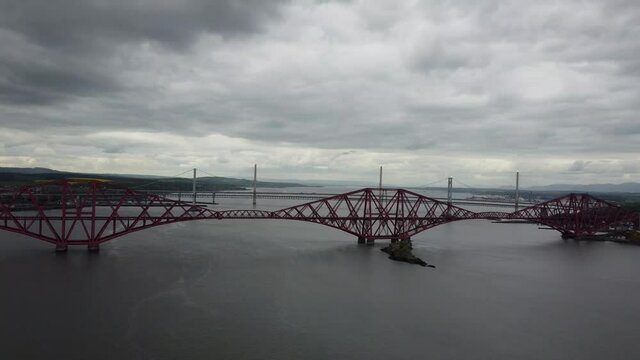 4k drone footage of the Forth Bridges crossing the Firth of Forth at Queensferry, Edinburgh, Scotland