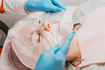 Applying a film mask on the face to steam and open pores, visit the spa.