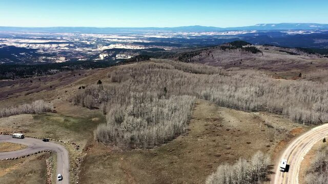 Panorama Of Cars Traveling At State Route 143 And Bare Aspen Woods At Dixie National Forest In Utah, United States. aerial