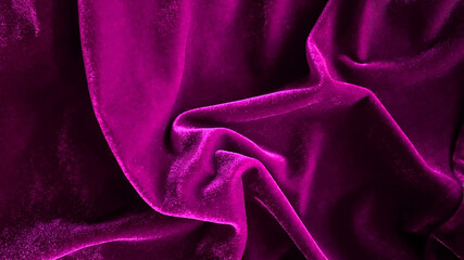 Purple magenta velvet fabric texture used as background. Empty purple fabric background of soft and smooth textile material. There is space for text.