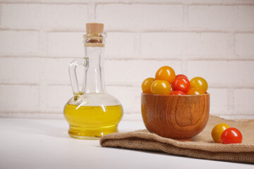 colorful cherry tomato and olive oil on table 