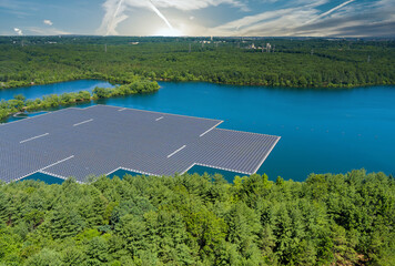 Panorama aerial view of floating farm solar panels cell park platform system on the lake