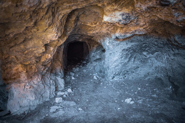 Abandoned adit interior. Dark tunnel of old magnesium mine