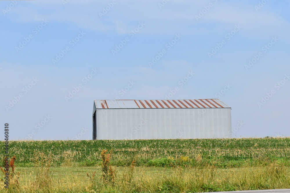 Sticker metal barn in a field