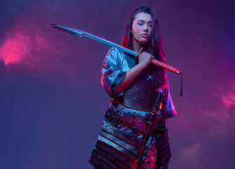 Woman dressed in samurai outfit with katana