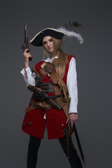 Dangerous woman pirate wearing coat and tricornered hat