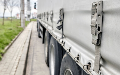 Shooting gallery, truck, road transport. Clamps holding a cargo.